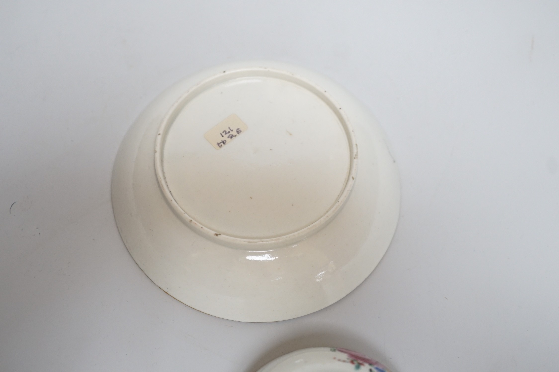 An 18th century Caughley teabowl and saucer, with back to back roses, saucer 12.5cms diameter